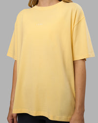 Woman wearing Go-To FLXCotton Oversized Tee - Lemon-White | Model:Leilani | Size:XS | Thumbnail Index: 3