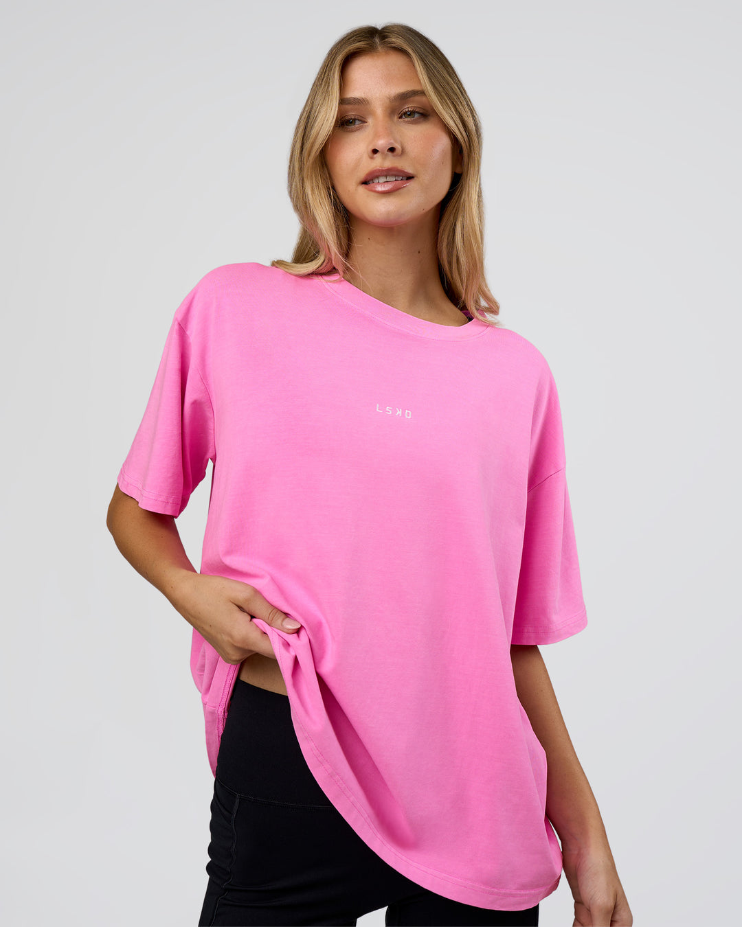 Woman wearing Go-To FLXCotton Oversized Tee - Ultra Fuchsia Washed | Model:Leilani | Size:XS - view 1