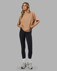 Woman wearing Go-To FLXCotton Oversized Tee - Warm Smoke-White | Model:Leilani | Size:XS | Thumbnail Index: 2