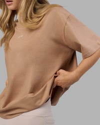 Woman wearing Go-To FLXCotton Oversized Tee - Warm Smoke-White | Model:Leilani | Size:XS | Thumbnail Index: 1