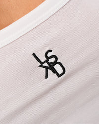 Woman wearing Go-To FLXCotton Scoop Neck Tank in White-Black | Model:Issy | Size:XS | Thumbnail Index: 2