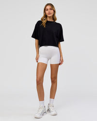 Woman wearing Go-To FLXCotton Skimmer Tee - Black-Black | Model:Leilani | Size:XS | Thumbnail Index: 1
