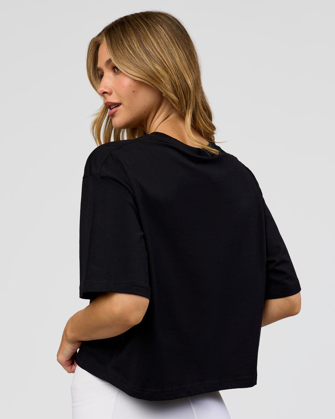 Woman wearing Go-To FLXCotton Skimmer Tee - Black-Black | Model:Leilani | Size:XS - view 3