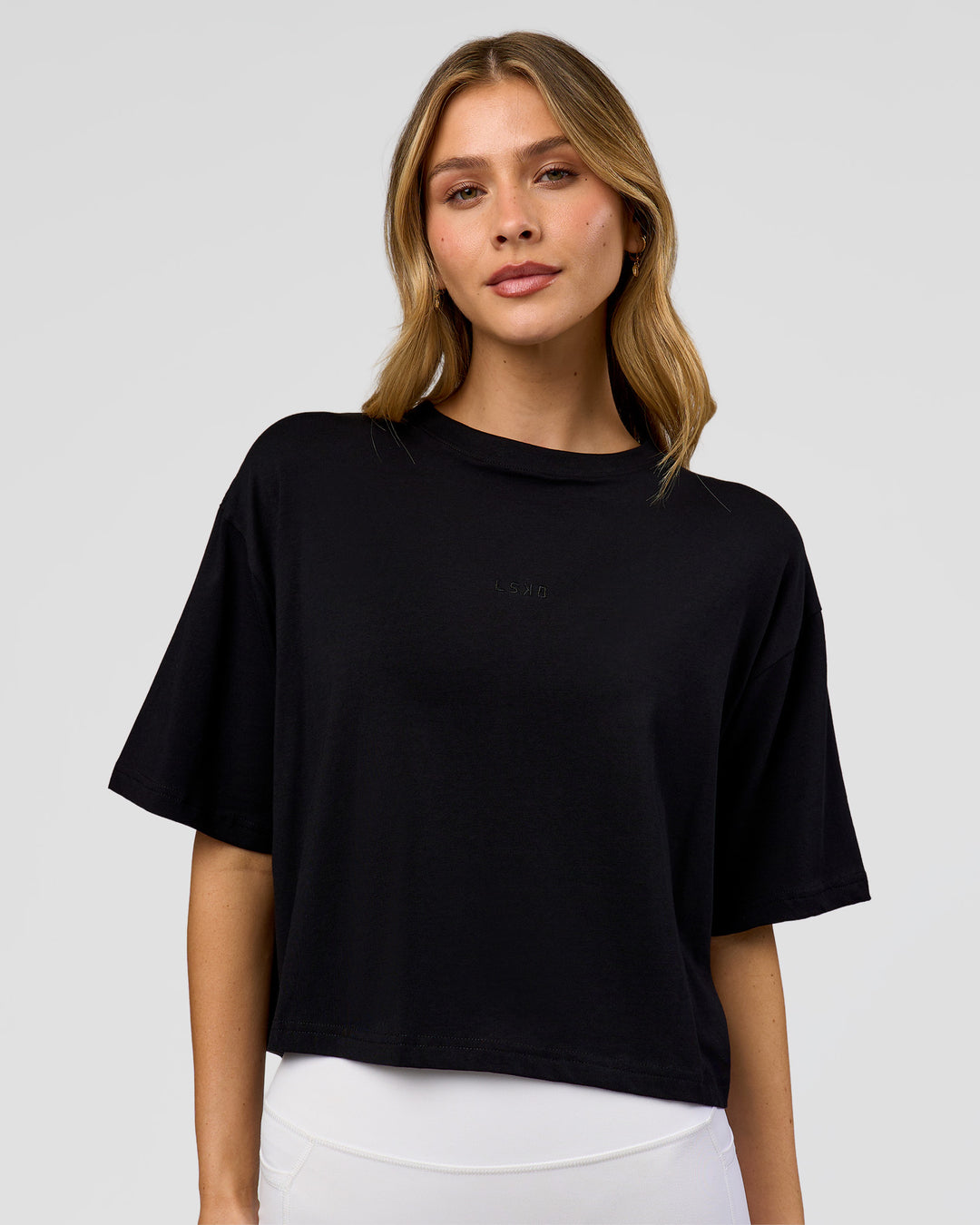 Woman wearing Go-To FLXCotton Skimmer Tee - Black-Black | Model:Leilani | Size:XS - view 1