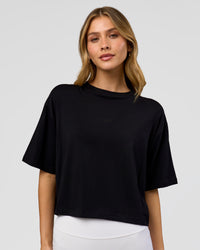 Woman wearing Go-To FLXCotton Skimmer Tee - Black-Black | Model:Leilani | Size:XS | Thumbnail Index: 0