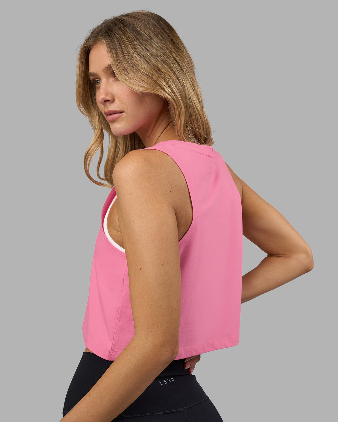 Woman wearing Go-To FLXCotton Tank - Candy Pink-White | Model:Leilani | Size:XS - view 3