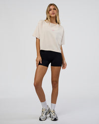 Woman wearing Go-To Heavy Weight FLXCotton Graphic Skimmer Tee - Off White-Multi | Model:Leilani | Size:XS | Thumbnail Index: 4
