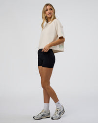 Woman wearing Go-To Heavy Weight FLXCotton Graphic Skimmer Tee - Off White-Multi | Model:Leilani | Size:XS | Thumbnail Index: 1