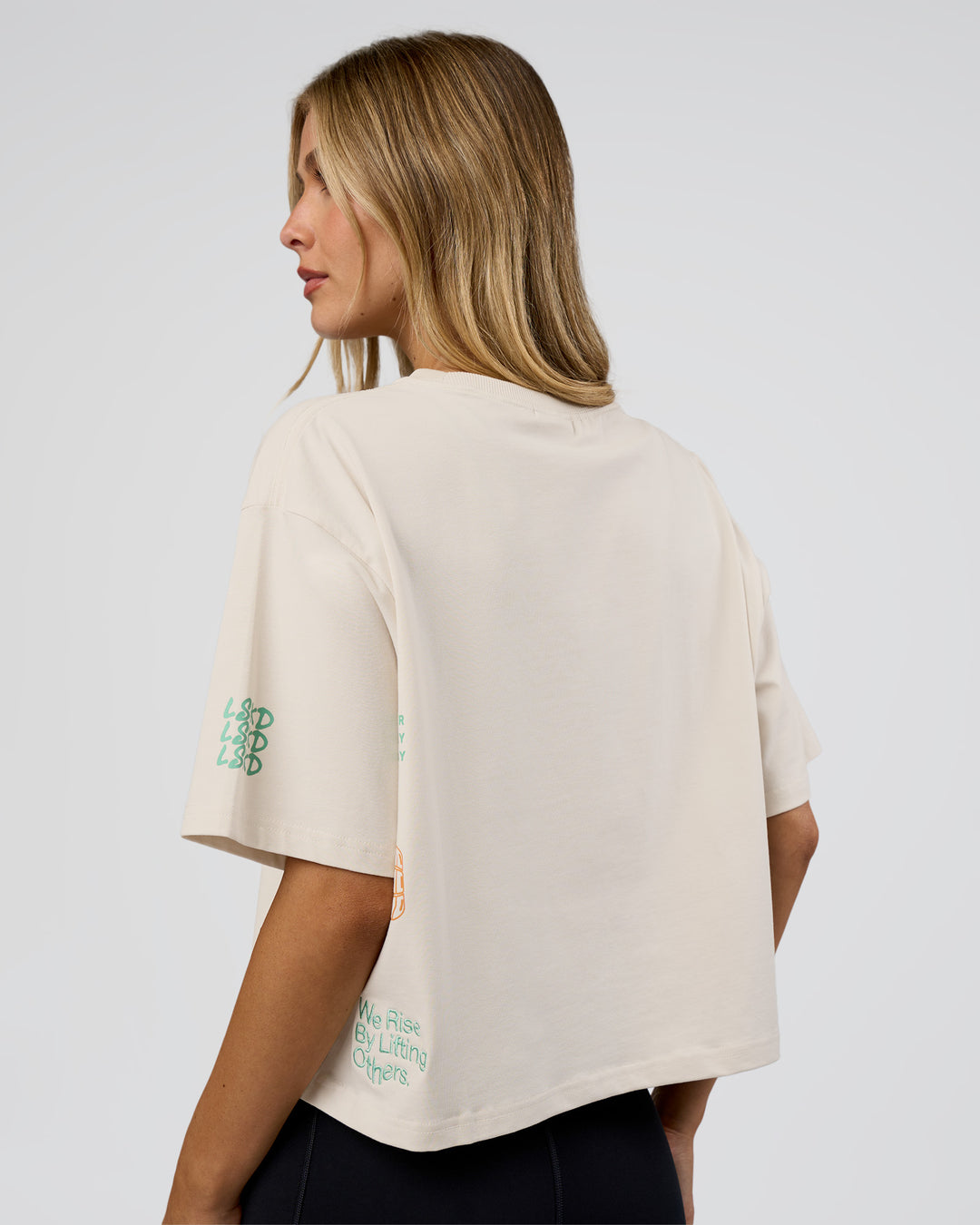 Woman wearing Go-To Heavy Weight FLXCotton Graphic Skimmer Tee - Off White-Multi | Model:Leilani | Size:XS - view 3
