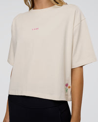 Woman wearing Go-To Heavy Weight FLXCotton Graphic Skimmer Tee - Off White-Multi | Model:Leilani | Size:XS | Thumbnail Index: 3