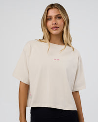 Woman wearing Go-To Heavy Weight FLXCotton Graphic Skimmer Tee - Off White-Multi | Model:Leilani | Size:XS | Thumbnail Index: 0