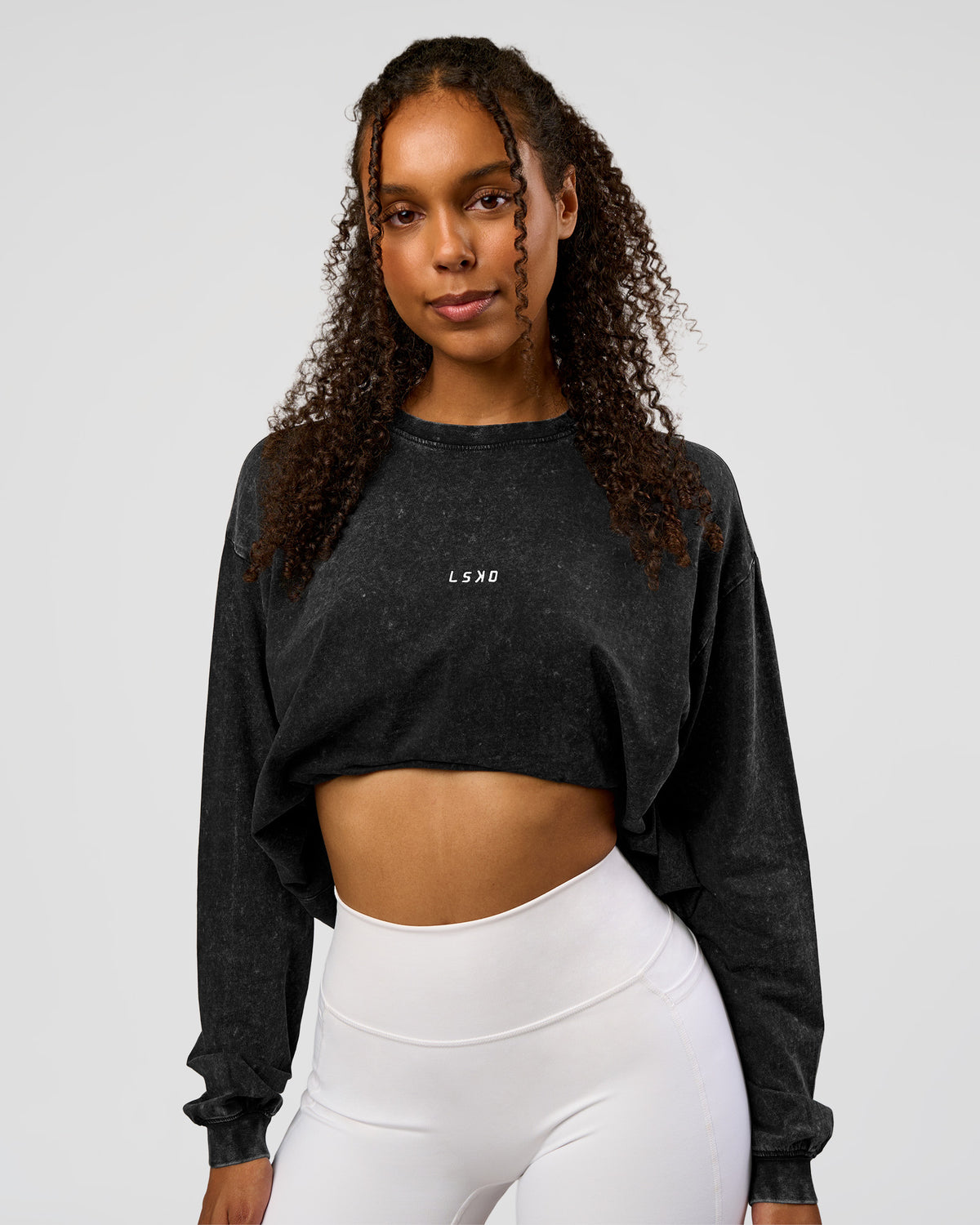 Woman wearing Go-To Long Sleeve FLXCotton Oversized Tee - Black Washed-White | Model:Jordan | SIze:XS