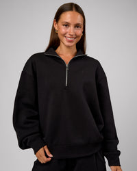 Woman wearing Go-To Oversized Quarter Zip Sweater - Black | Model:Brylee | Size:XS | Thumbnail Index: 7