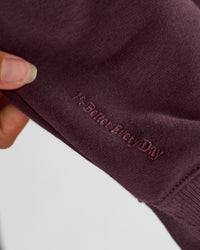 Woman wearing Go-To Oversized Quarter Zip Sweater - Midnight Plum | Model:Brylee | Size:XS | Thumbnail Index: 3