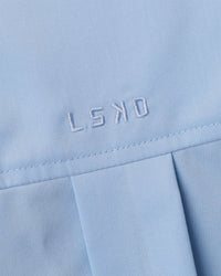 Woman wearing Go-To Oversized Shirt - Poplin Blue | Model:Leilani | Size:XS | Thumbnail Index: 6