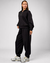 Woman wearing Go-To Oversized Track Pant - Black | Model:Brylee | Size:XS | Thumbnail Index: 4