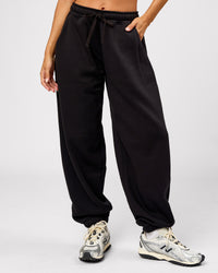 Woman wearing Go-To Oversized Track Pant - Black | Model:Brylee | Size:XS | Thumbnail Index: 5