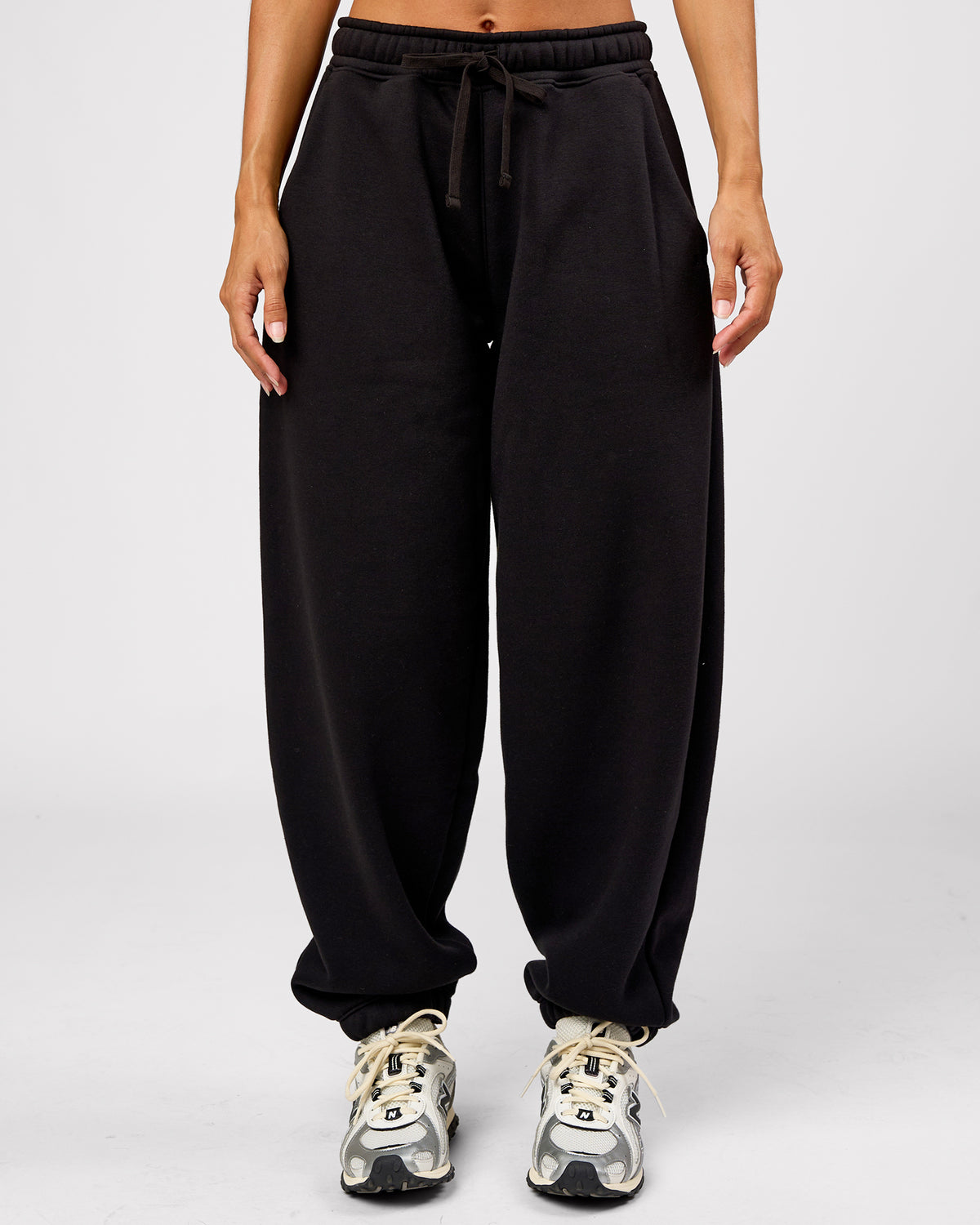 Woman wearing Go-To Oversized Track Pant - Black | Model:Brylee | Size:XS