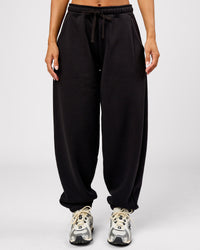 Woman wearing Go-To Oversized Track Pant - Black | Model:Brylee | Size:XS | Thumbnail Index: 0