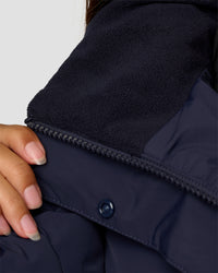 Woman wearing Go-To Puffer Jacket - Future Navy | Model:Brylee | Size:XS | Thumbnail Index: 2