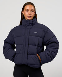 Woman wearing Go-To Puffer Jacket - Future Navy | Model:Brylee | Size:XS | Thumbnail Index: 9