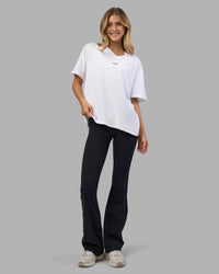 Woman wearing Go-To V-Neck FLXCotton Oversized Tee - White-Black | Model:Leilani | Size:XS | Thumbnail Index: 3