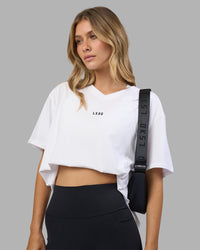 Woman wearing Go-To V-Neck FLXCotton Oversized Tee - White-Black | Model:Leilani | Size:XS | Thumbnail Index: 4