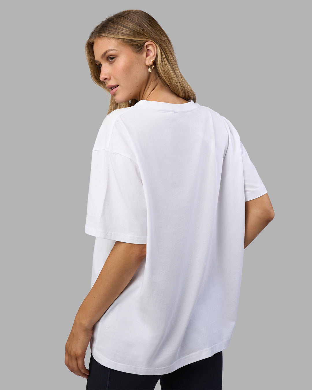 Woman wearing Go-To V-Neck FLXCotton Oversized Tee - White-Black | Model:Leilani | Size:XS - view 3