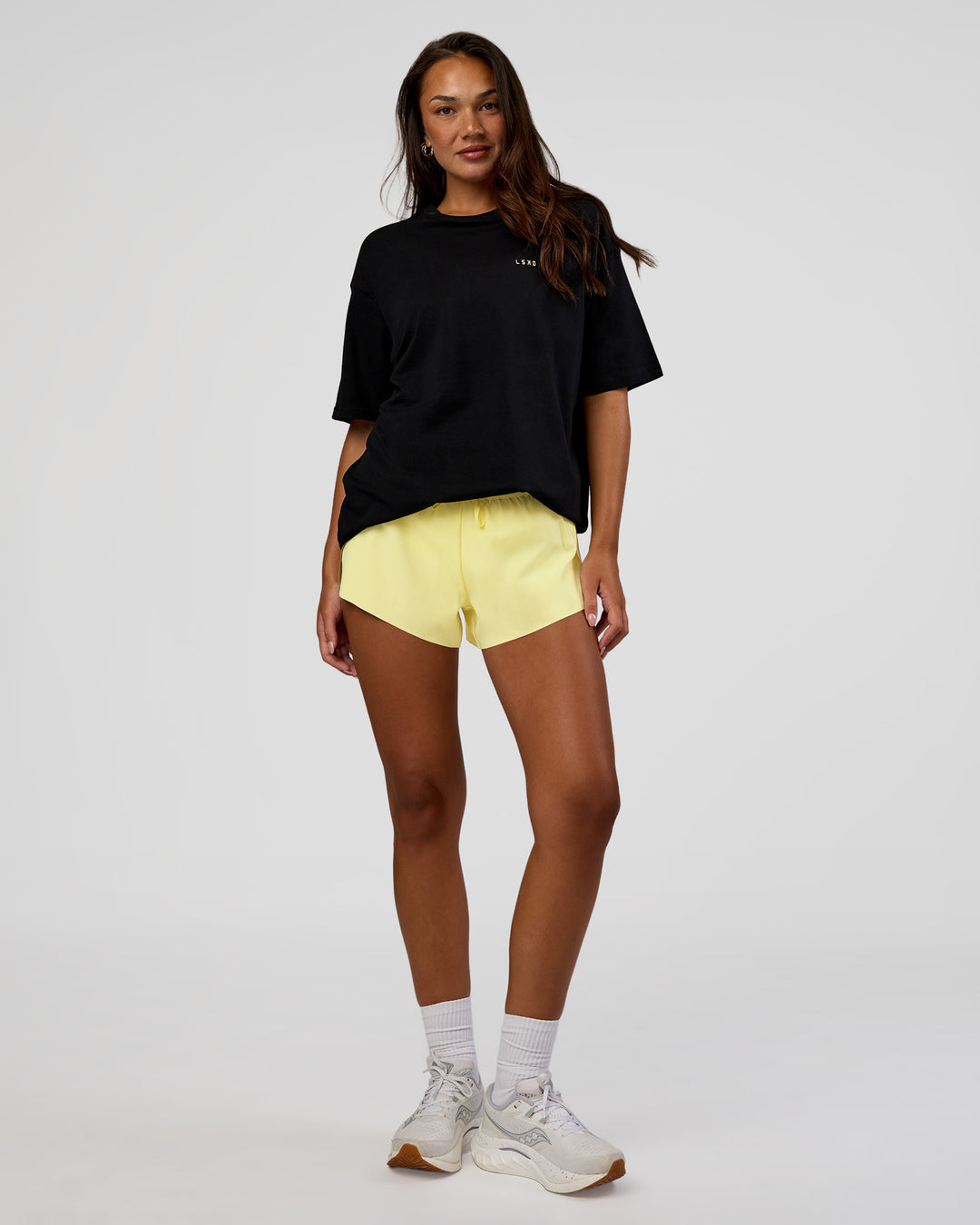 Woman wearing High Run FLXCotton Oversized Tee - Black-Yellow Fizz | Model:Kirstyn | Size:XS - view 11