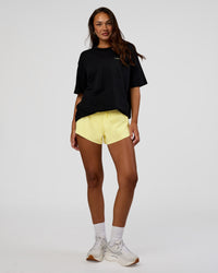 Woman wearing High Run FLXCotton Oversized Tee - Black-Yellow Fizz | Model:Kirstyn | Size:XS | Thumbnail Index: 10