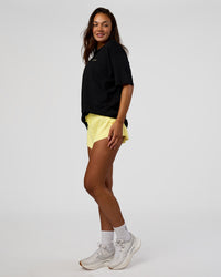Woman wearing High Run FLXCotton Oversized Tee - Black-Yellow Fizz | Model:Kirstyn | Size:XS | Thumbnail Index: 6