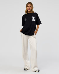 Woman wearing Hype Heavyweight Unisex Oversized Tee - Black-White | Model:Leilani | Size:XS | Thumbnail Index: 13