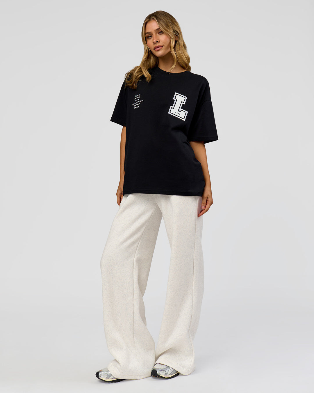 Woman wearing Hype Heavyweight Unisex Oversized Tee - Black-White | Model:Leilani | Size:XS - view 15