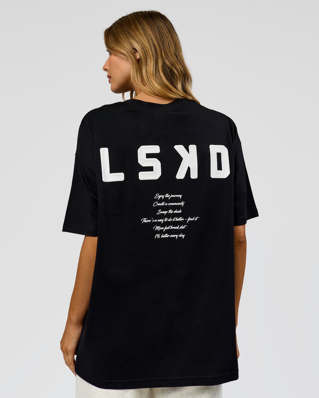 Woman wearing Hype Heavyweight Unisex Oversized Tee - Black-White | Model:Leilani | Size:XS - view 16