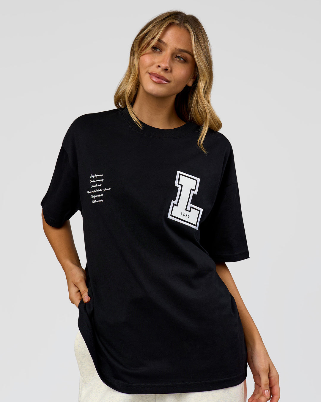 Woman wearing Hype Heavyweight Unisex Oversized Tee - Black-White | Model:Leilani | Size:XS - view 17