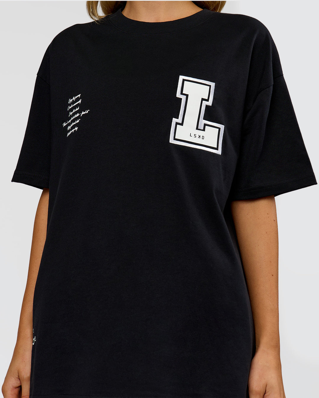 Woman wearing Hype Heavyweight Unisex Oversized Tee - Black-White | Model:Leilani | Size:XS - view 18