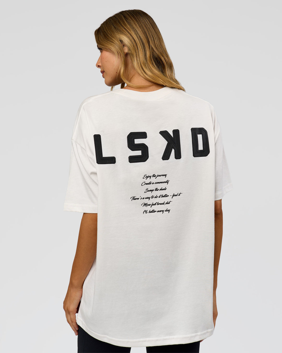 Woman wearing Hype Heavyweight Unisex Oversized Tee - Off White-Black | Model:Leilani | Size:XS - view 15