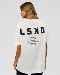 Woman wearing Hype Heavyweight Unisex Oversized Tee - Off White-Black | Model:Leilani | Size:XS | Thumbnail Index: 14