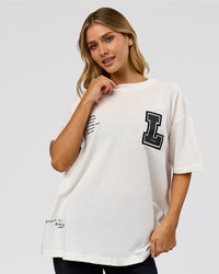 Woman wearing Hype Heavyweight Unisex Oversized Tee - Off White-Black | Model:Leilani | Size:XS | Thumbnail Index: 16