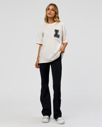 Woman wearing Hype Heavyweight Unisex Oversized Tee - Off White-Black | Model:Leilani | Size:XS | Thumbnail Index: 17