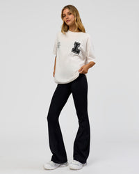 Woman wearing Hype Heavyweight Unisex Oversized Tee - Off White-Black | Model:Leilani | Size:XS | Thumbnail Index: 18