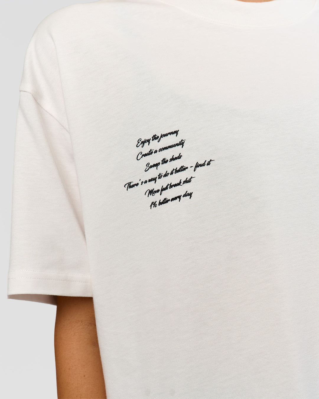 Woman wearing Hype Heavyweight Unisex Oversized Tee - Off White-Black | Model:Leilani | Size:XS - view 22