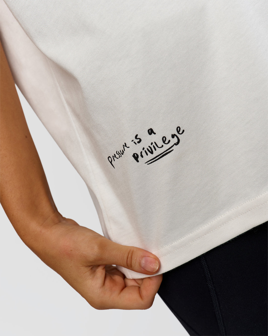 Woman wearing Hype Heavyweight Unisex Oversized Tee - Off White-Black | Model:Leilani | Size:XS - view 23