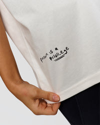 Woman wearing Hype Heavyweight Unisex Oversized Tee - Off White-Black | Model:Leilani | Size:XS | Thumbnail Index: 22