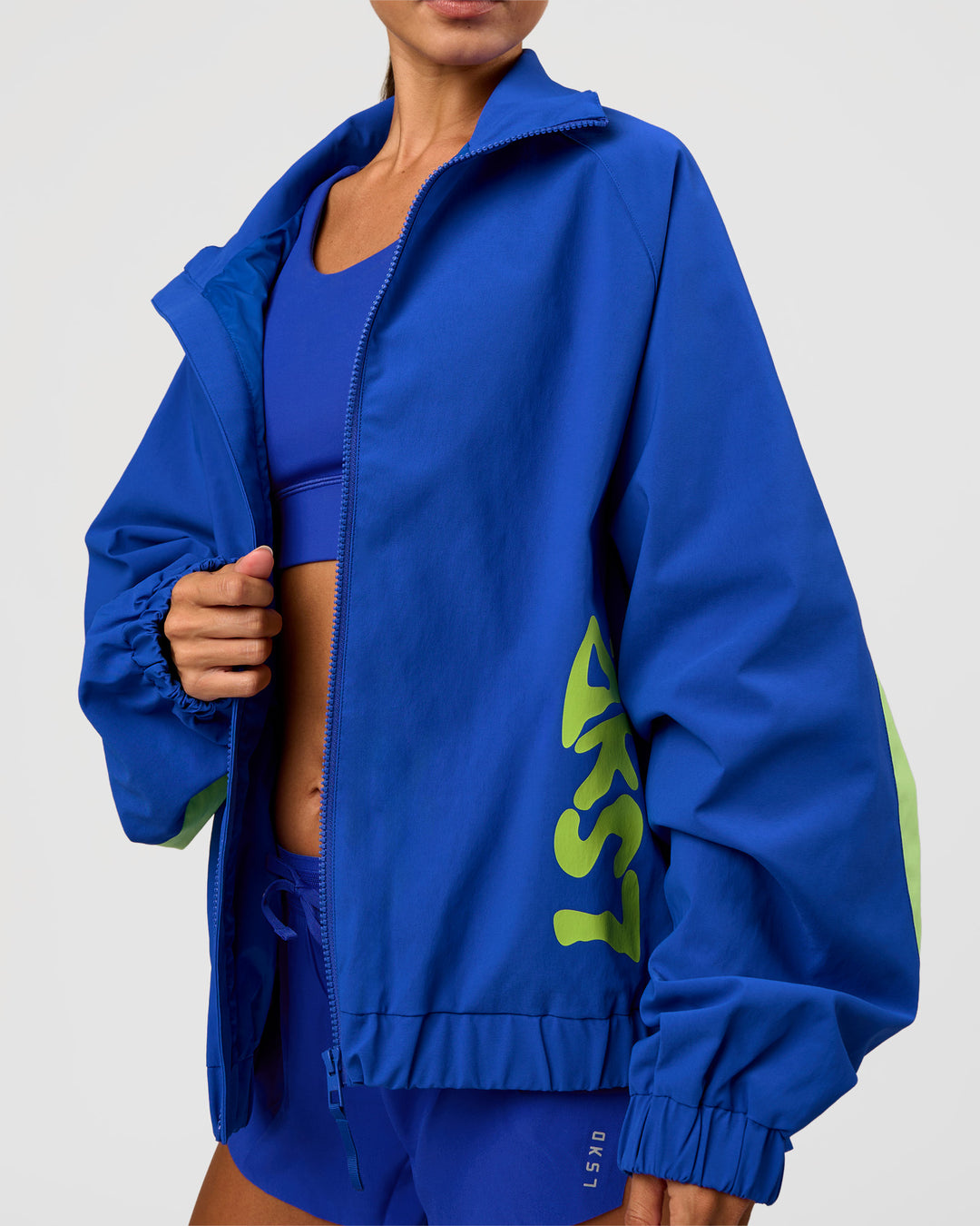 Woman wearing Hype Oversized Track Jacket - Electric Indigo | Model:Brylee | Size:XS - view 9
