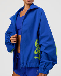 Woman wearing Hype Oversized Track Jacket - Electric Indigo | Model:Brylee | Size:XS | Thumbnail Index: 8