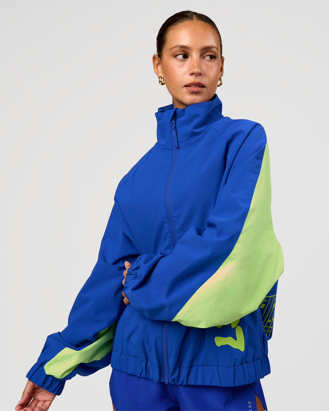 Woman wearing Hype Oversized Track Jacket - Electric Indigo | Model:Brylee | Size:XS - view 8