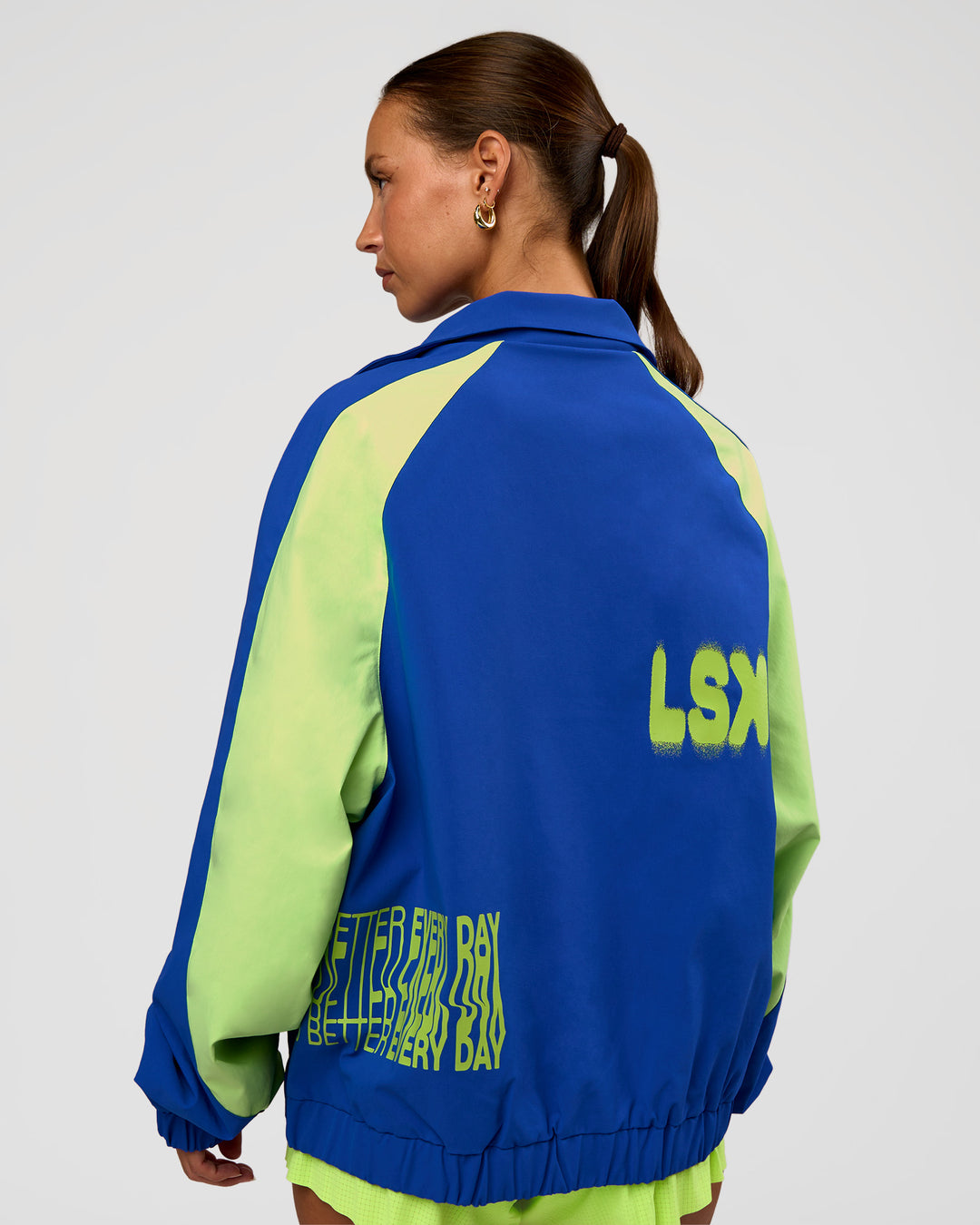 Woman wearing Hype Oversized Track Jacket - Electric Indigo | Model:Brylee | Size:XS - view 4