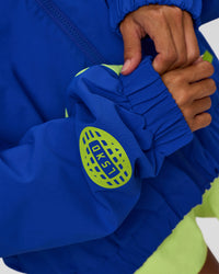 Woman wearing Hype Oversized Track Jacket - Electric Indigo | Model:Brylee | Size:XS | Thumbnail Index: 4