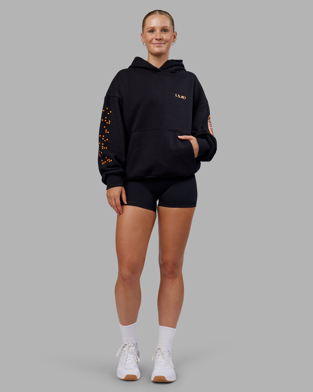 Woman wearing Hyped Unisex Oversized Hoodie - Black-Vibrant Orange | Model:Neve | Size:XS - view 10